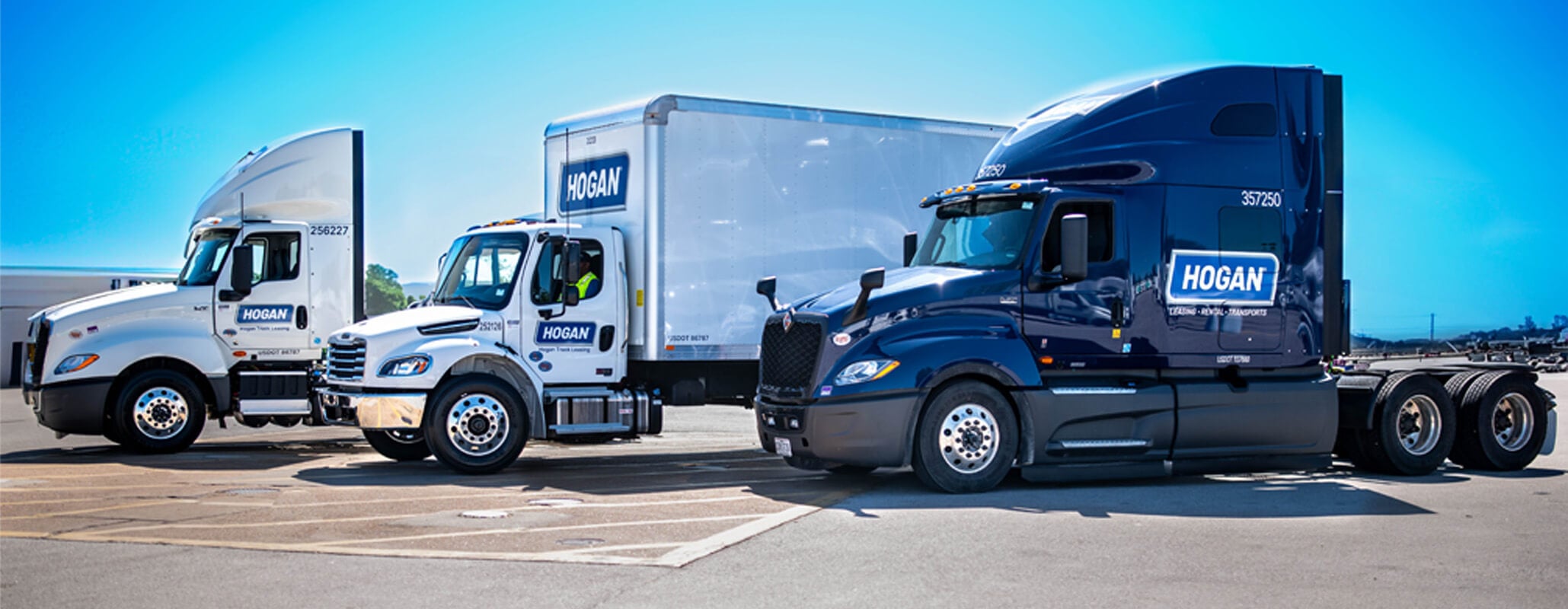 Photo of 3 heavy duty and medium duty Hogan trucks